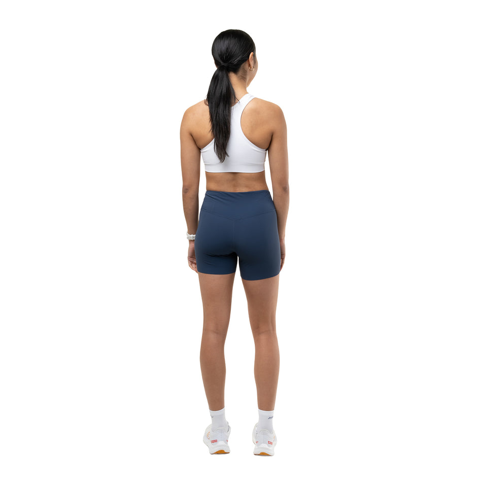 Back view of a model wearing the Ronhill Women's Tech Race Stretch Short in the Evening Haze colourway.