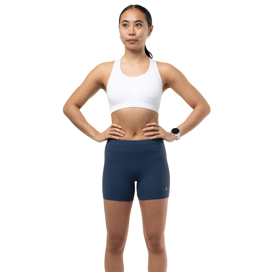 Front view of a model wearing the Ronhill Women's Tech Race Stretch Short in the Evening Haze colourway.