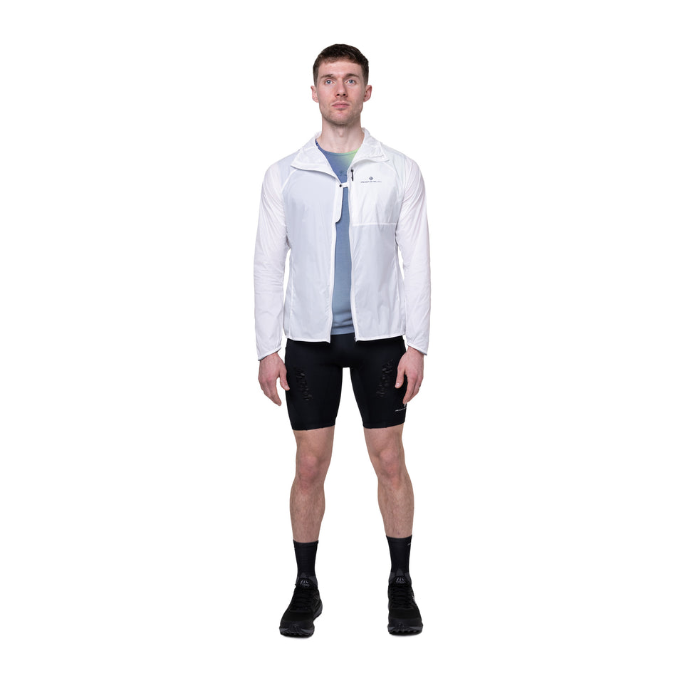 Front view of a model wearing the Ronhill Men's Tech All-Terrain Jacket in the Bright White colourway. 