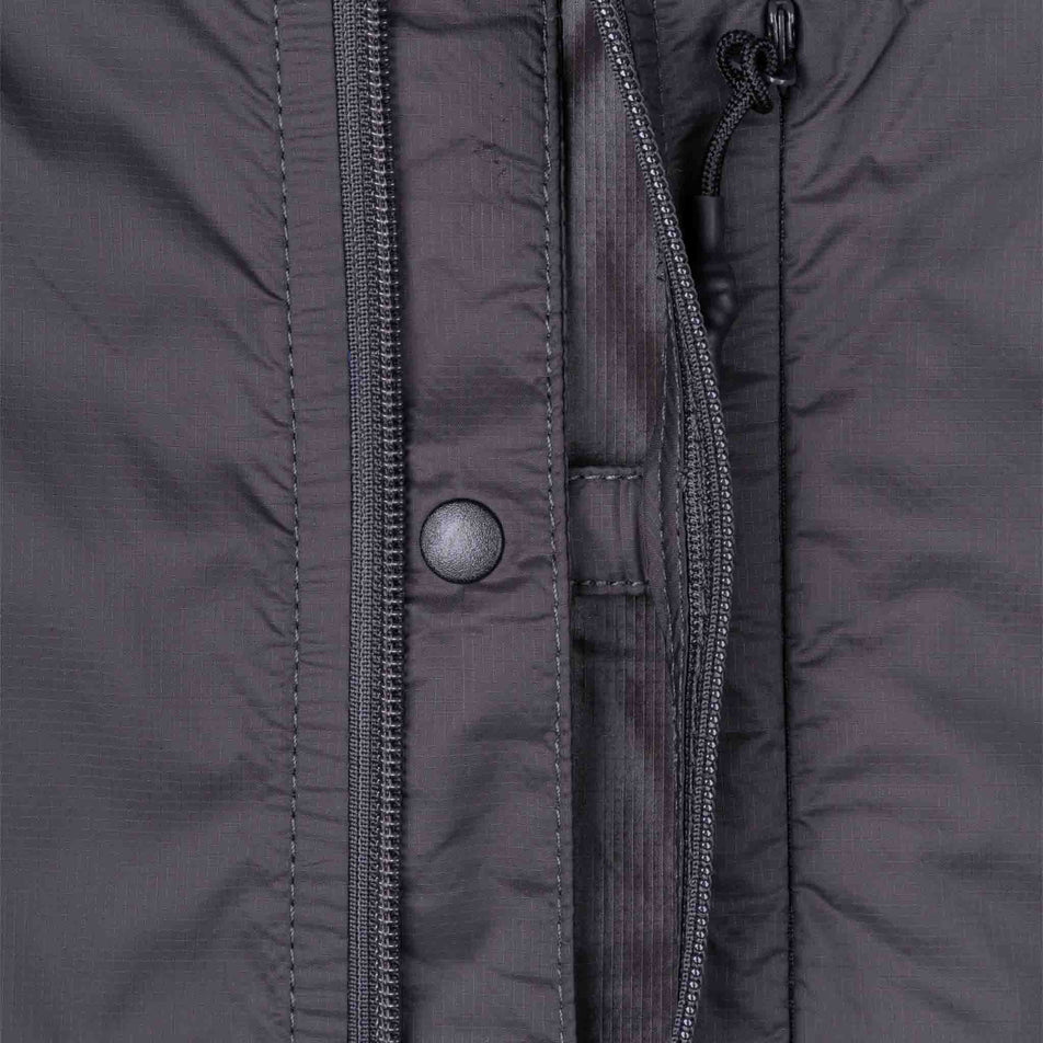 The chest clip on the Ronhill Men's Tech All-Terrain Jacket in the Oxide/Ronhill Red colourway.