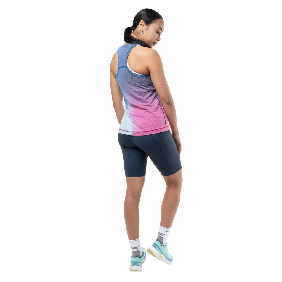 Back view of a model wearing the Ronhill Women's Tech Golden Hour Vest in the Exuberance Merge colourway.
