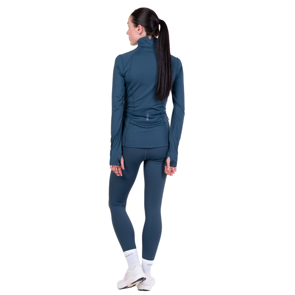 Back view of a model wearing the Ronhill Women's Tech Contour Jacket in the Evening Haze colourway. 