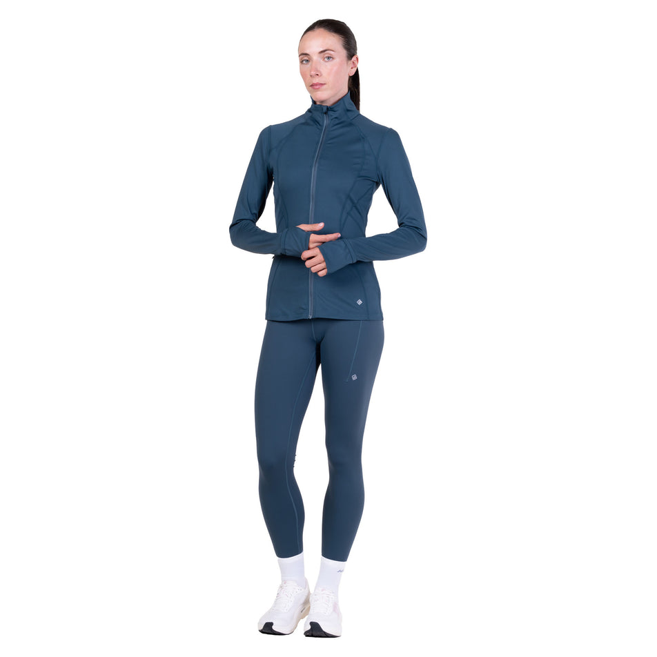 Front view of a model wearing the Ronhill Women's Tech Contour Jacket in the Evening Haze colourway. 