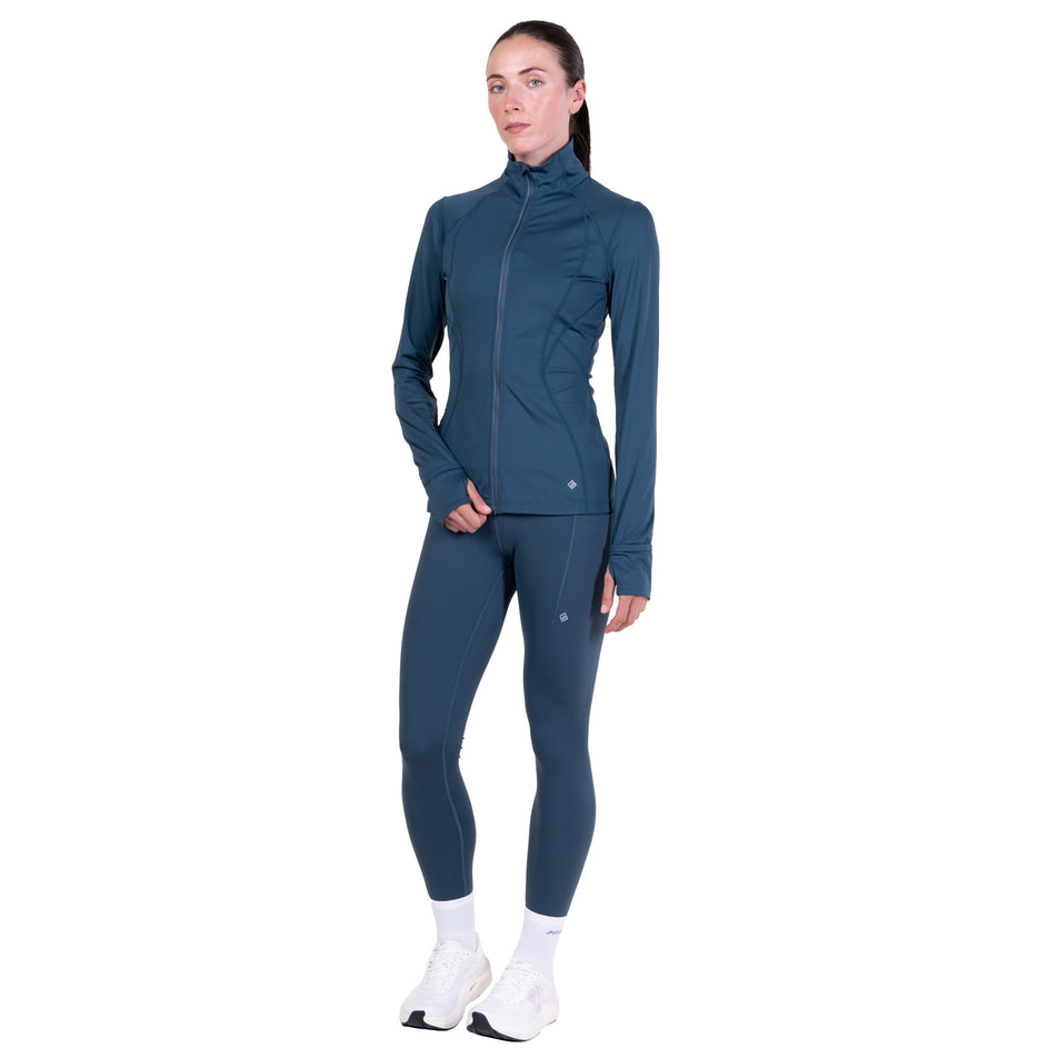 Front view of a model wearing the Ronhill Women's Tech Contour Jacket in the Evening Haze colourway. 