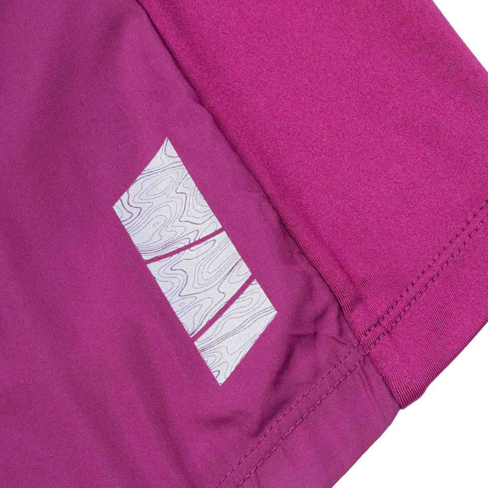 The reflective detail on the Ronhill Women's Tech Wind-Block 1/2 Zip in the Blackcurrant colourway.