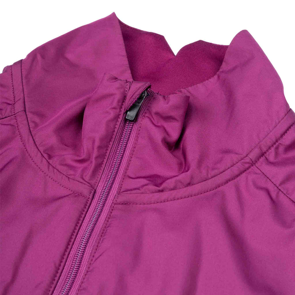The front zip on the Ronhill Women's Tech Wind-Block 1/2 Zip in the Blackcurrant colourway.