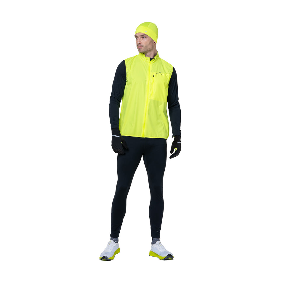 Front view of a model wearing the Ronhill Men's Core Gilet in the Fluo Yellow/Black colourway. (8748546195618)
