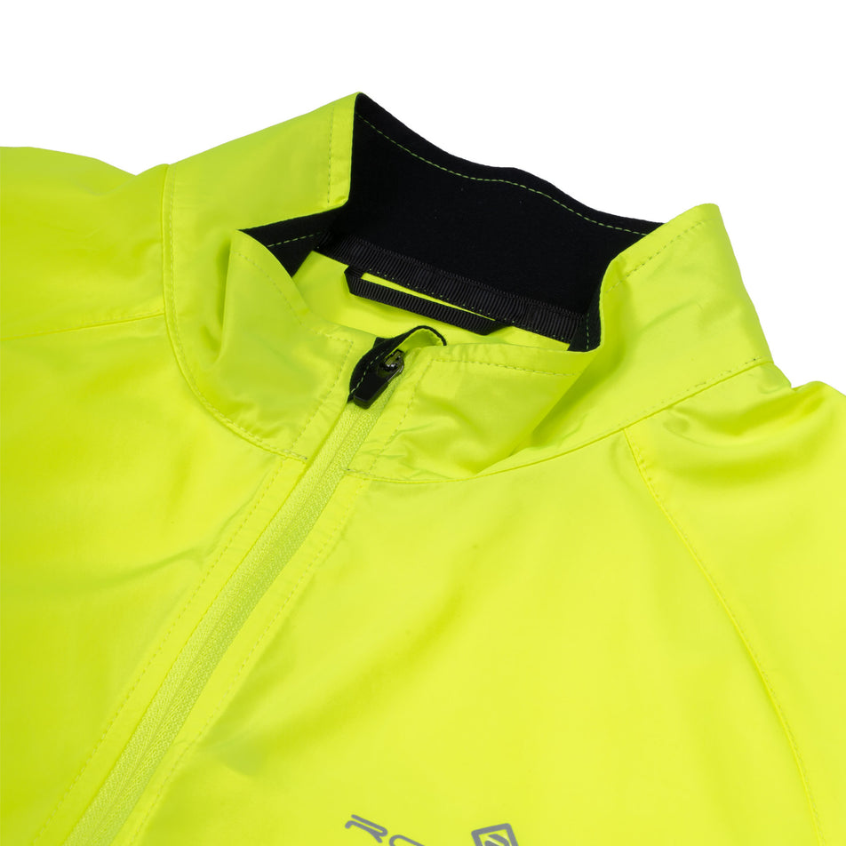 Close-up view of the neckline of the Ronhill Women's Core Jacket in the Fluo Zest colourway.