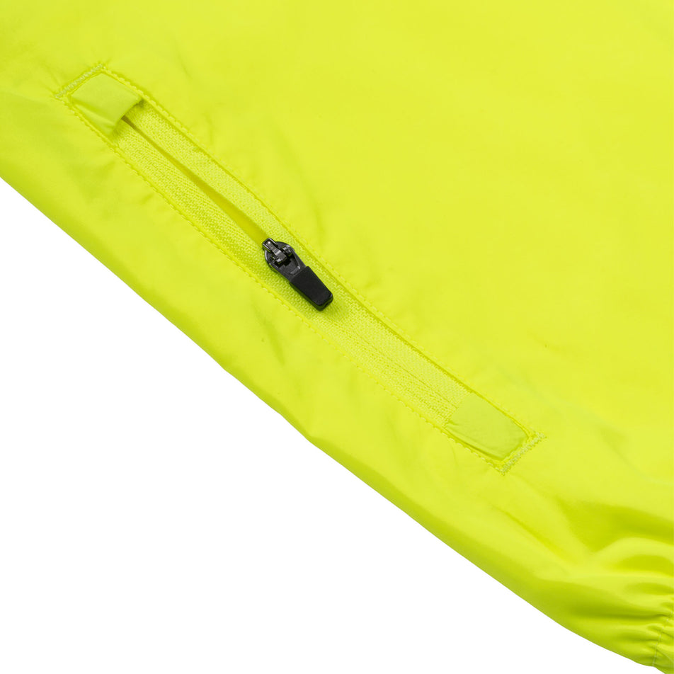 Close-up view of the sleeve of the Ronhill Women's Core Jacket in the Fluo Zest colourway.
