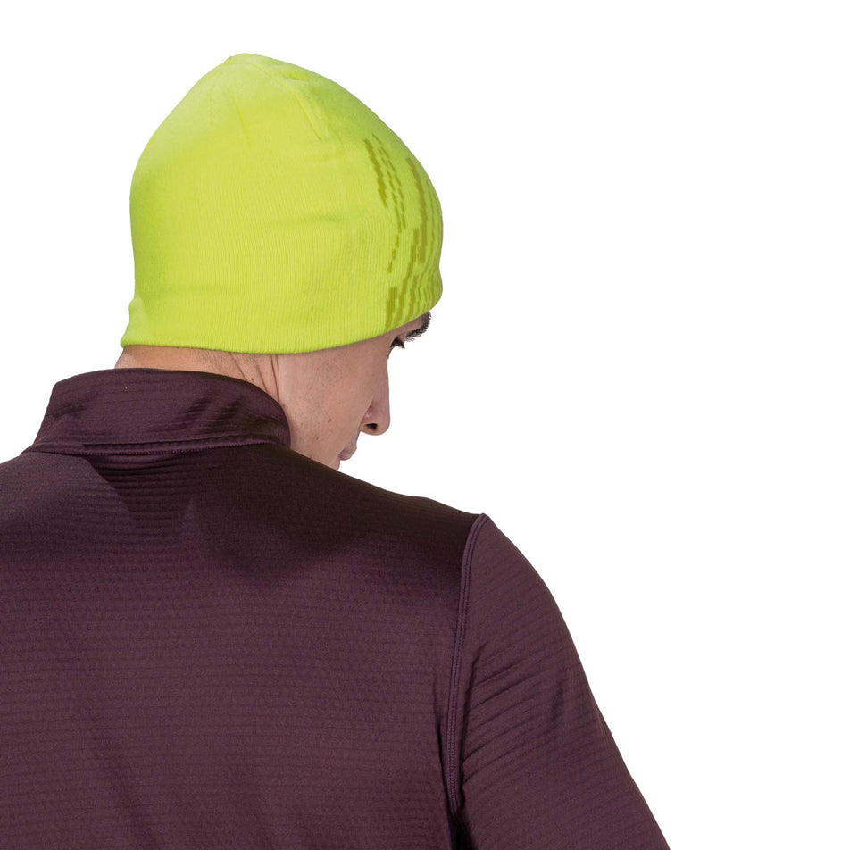 Back view of a model wearing the Ronhill Unisex Run Beanie in the Fluo Zest/Black colourway.