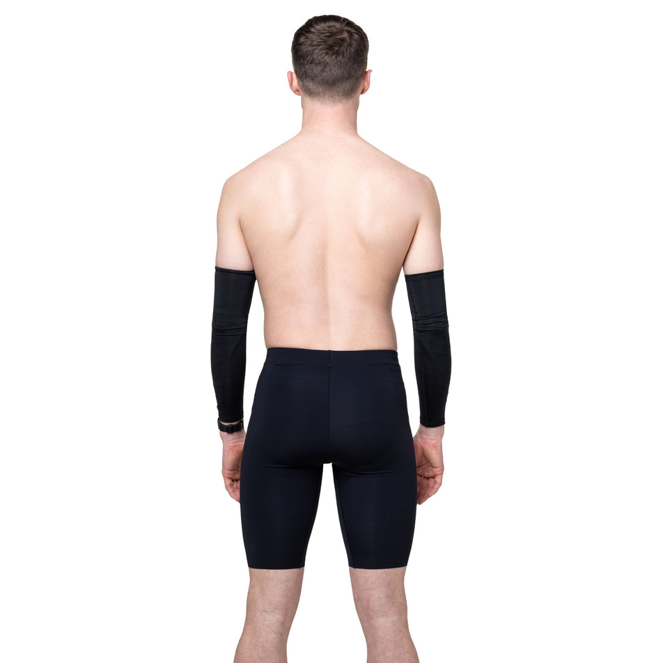 Back view of a model wearing the Ronhill Men's Tech Race Half Tight in the All Black colourway.