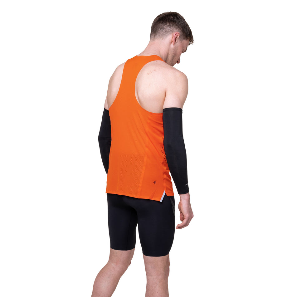 Back view of a model wearing the Ronhill Men's Tech Race Half Tight in the All Black colourway.