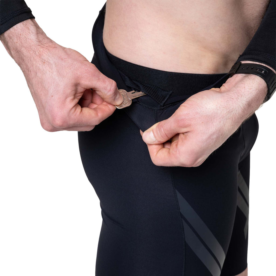 The key pouch in the waistband of the Ronhill Men's Tech Race Half Tight in the All Black colourway.