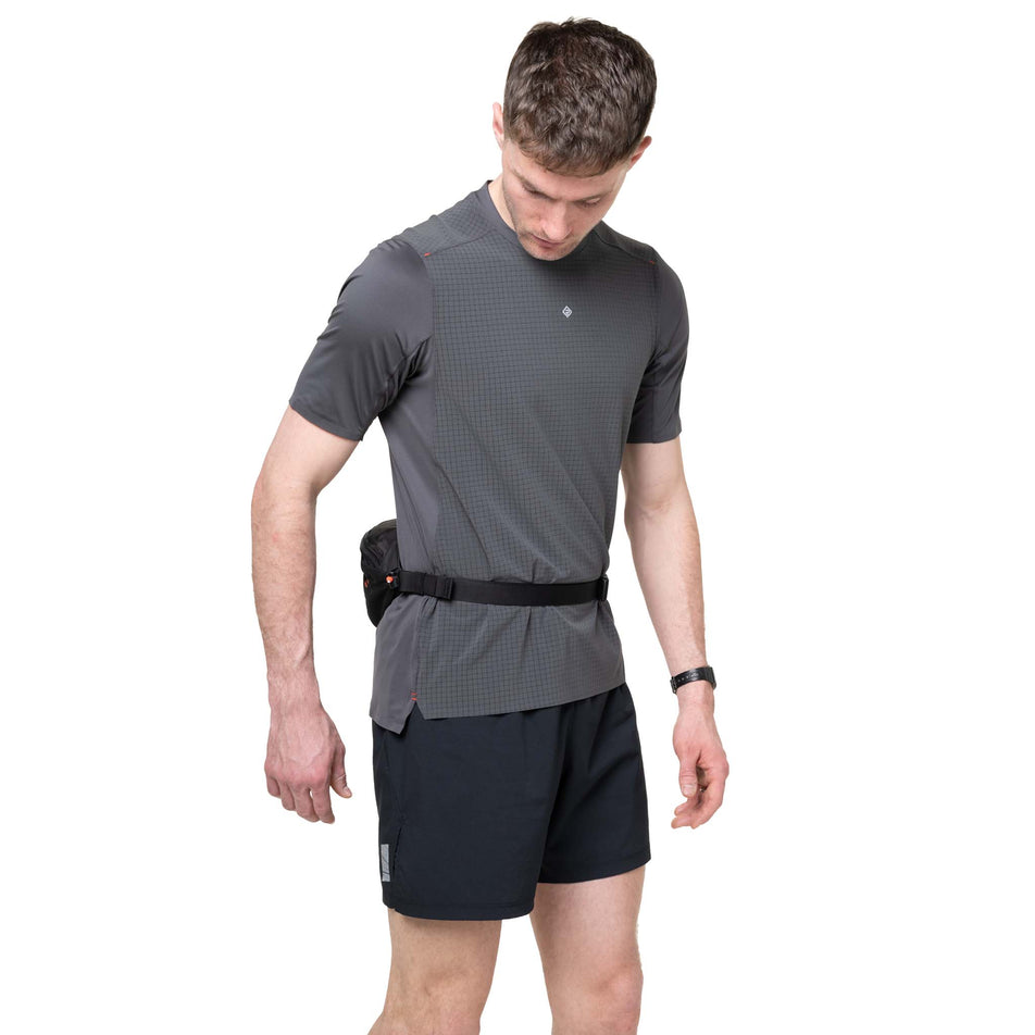 Front view of a model wearing the Ronhill Unisex Speed 180 in the Black/Ronhill Red colourway.