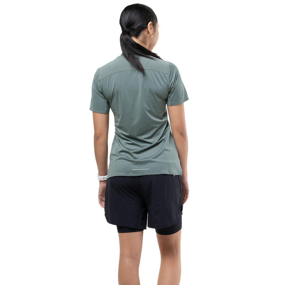 Back view of a model wearing the Ronhill Women's Tech All-Terrain S/S Tee in the Laurel colourway.