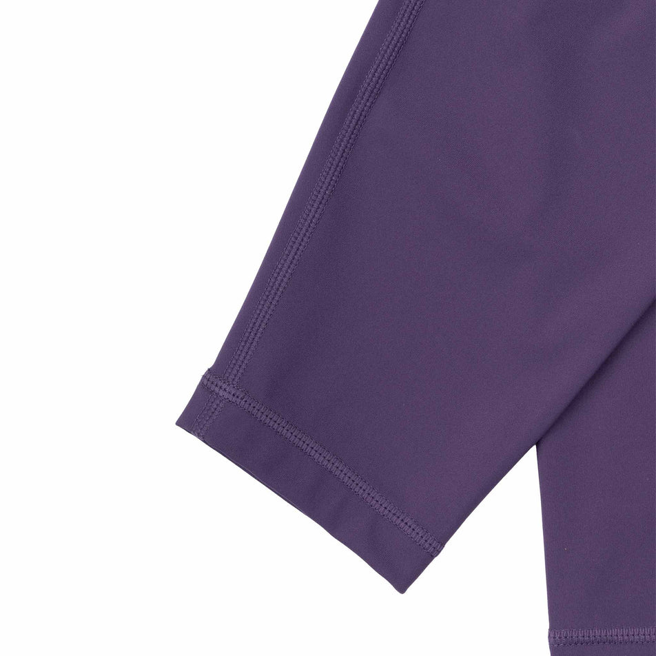The ankle cuff of the Ronhill Women's Tech Contour Tight in the Noir Iris colourway.
