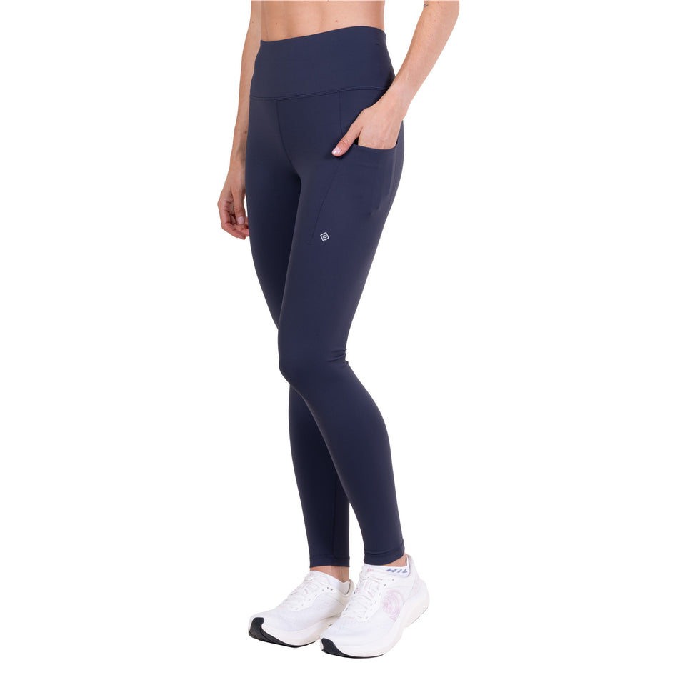 Angled view of a model wearing the Ronhill Women's Tech Contour Tight in the Polar Night colourway.