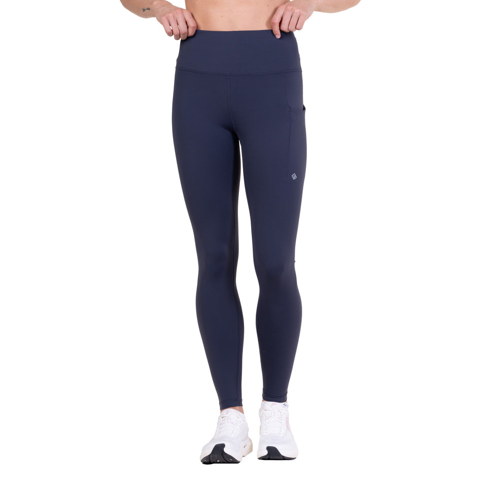Front view of a model wearing the Ronhill Women's Tech Contour Tight in the Polar Night colourway.