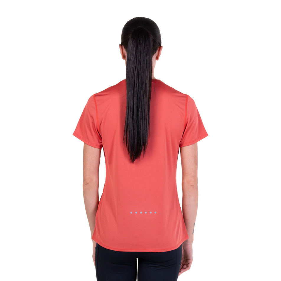 Back view of a model wearing the Ronhill Women's Core S/S Tee in the Sumac colourway.