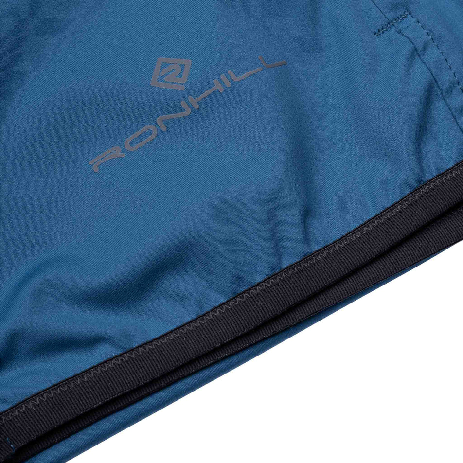 The hem of the Ronhill Women's Tech Wind-Block Jacket in the Legion Blue colourway.