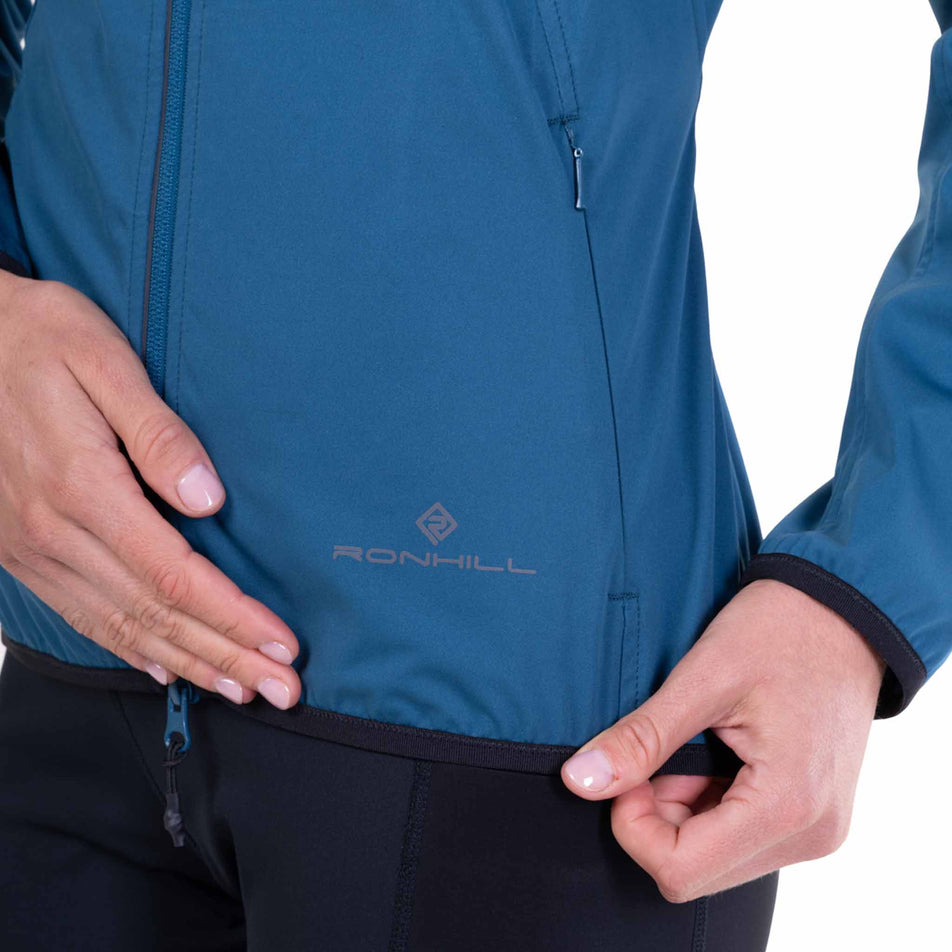 The hem of the Ronhill Women's Tech Wind-Block Jacket in the Legion Blue colourway.