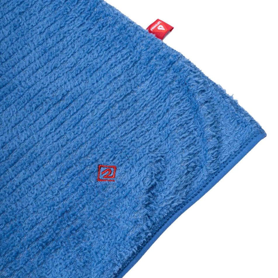 The Ronhill logo on the Ronhill Women's Tech Winter Primaloft Hoodie in the Lumiere/Sumac colourway.