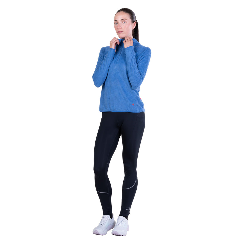 Front view of a model wearing the Ronhill Women's Tech Winter Primaloft Hoodie in the Lumiere/Sumac colourway.