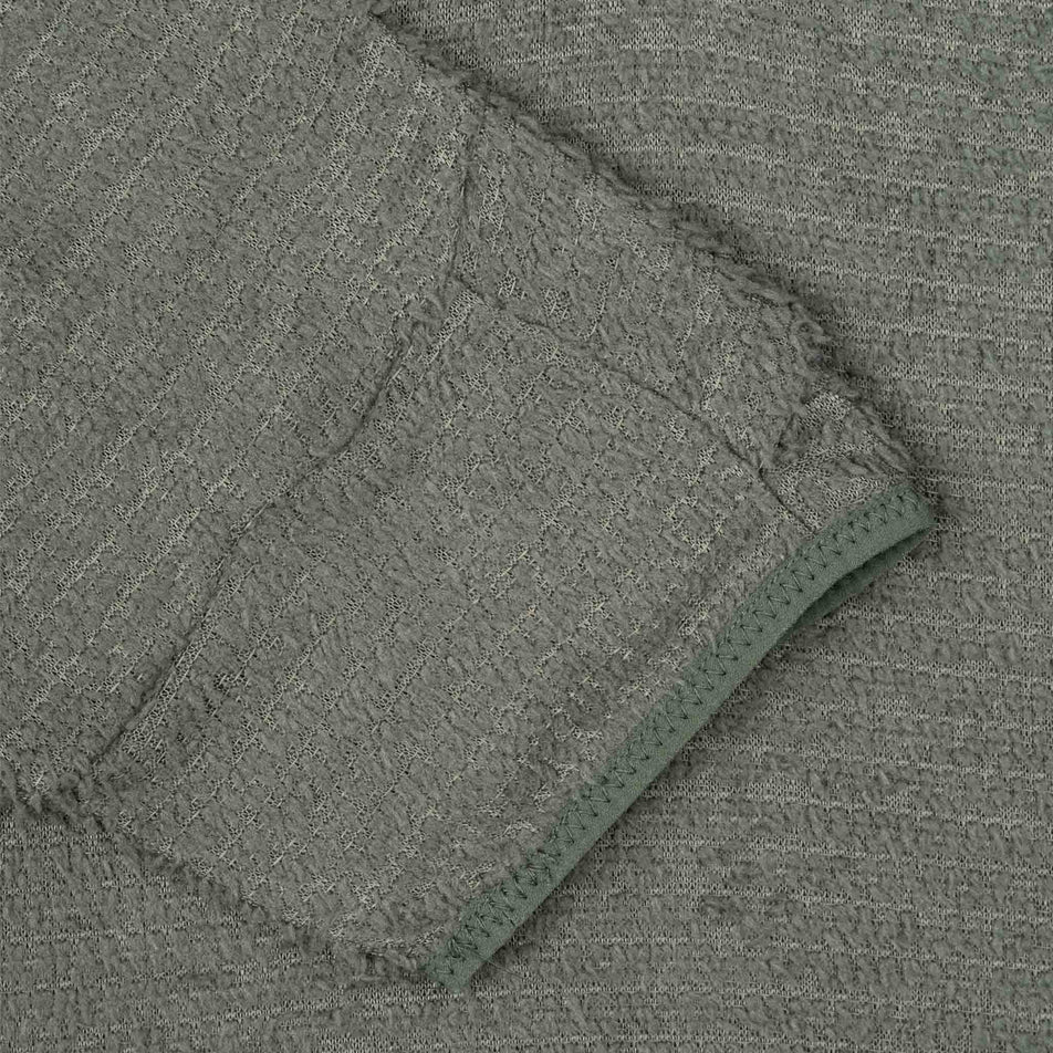 The sleeve on the Ronhill Men's Tech Winter Primaloft Hoodie in the Kelp/Zest colourway.