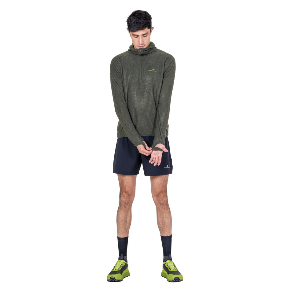 Front view of a model wearing the Ronhill Men's Tech Winter Primaloft Hoodie in the Kelp/Zest colourway.