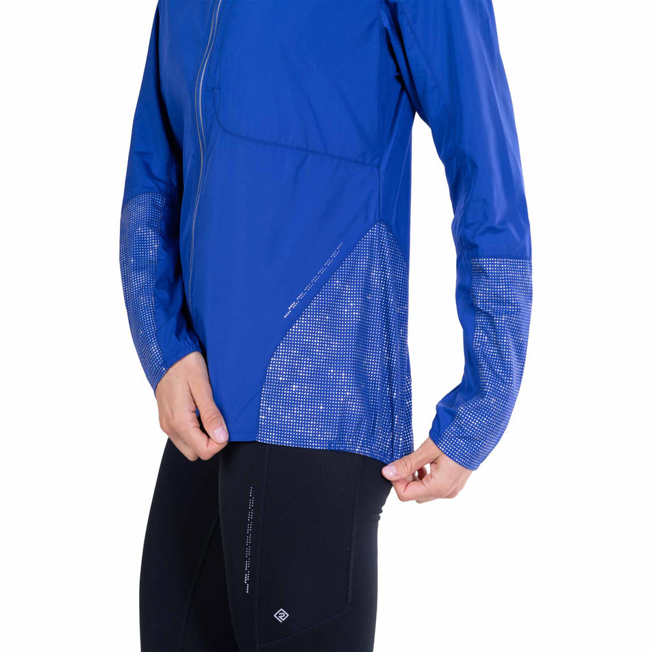 The reflective graphics on the Ronhill Women's Tech Reflect Jacket in the Blue Violet/Reflect colourway.