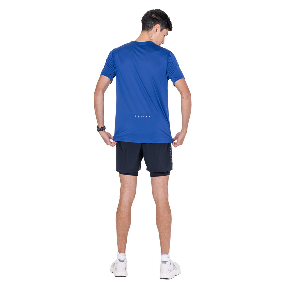 Back view of a model wearing the Ronhill Men's Core S/S Tee in the Dark Cobalt/Silver colourway.