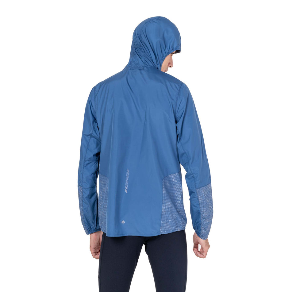 Back view of a model wearing the Ronhill Men's Tech Reflect Jacket in the Glacier/Reflect colourway.