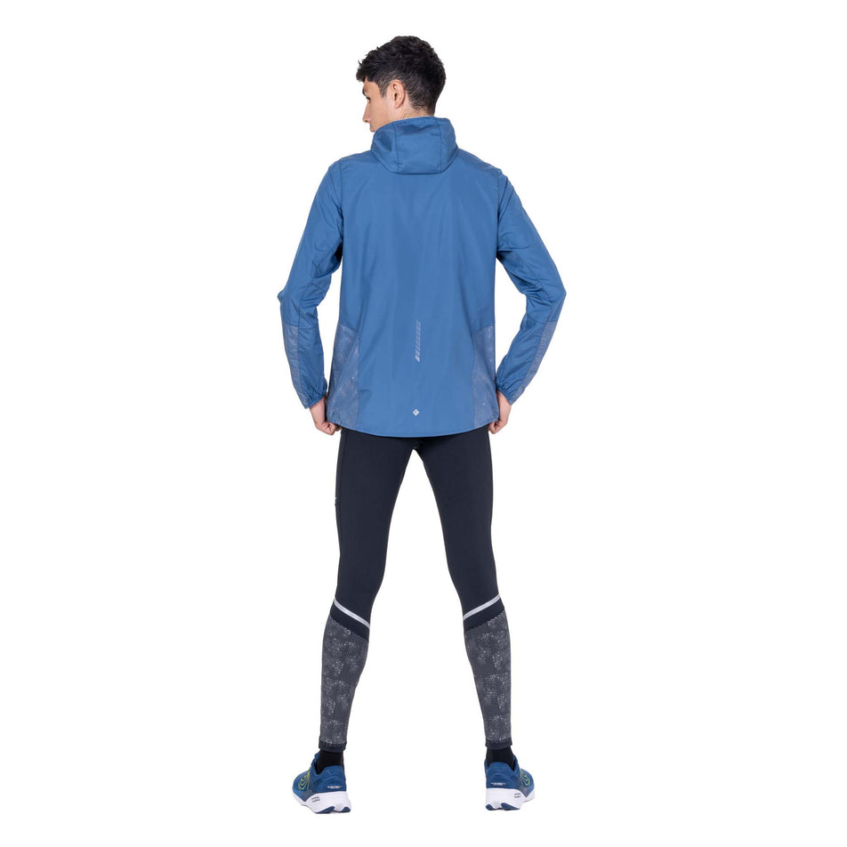 Back view of a model wearing the Ronhill Men's Tech Reflect Jacket in the Glacier/Reflect colourway.