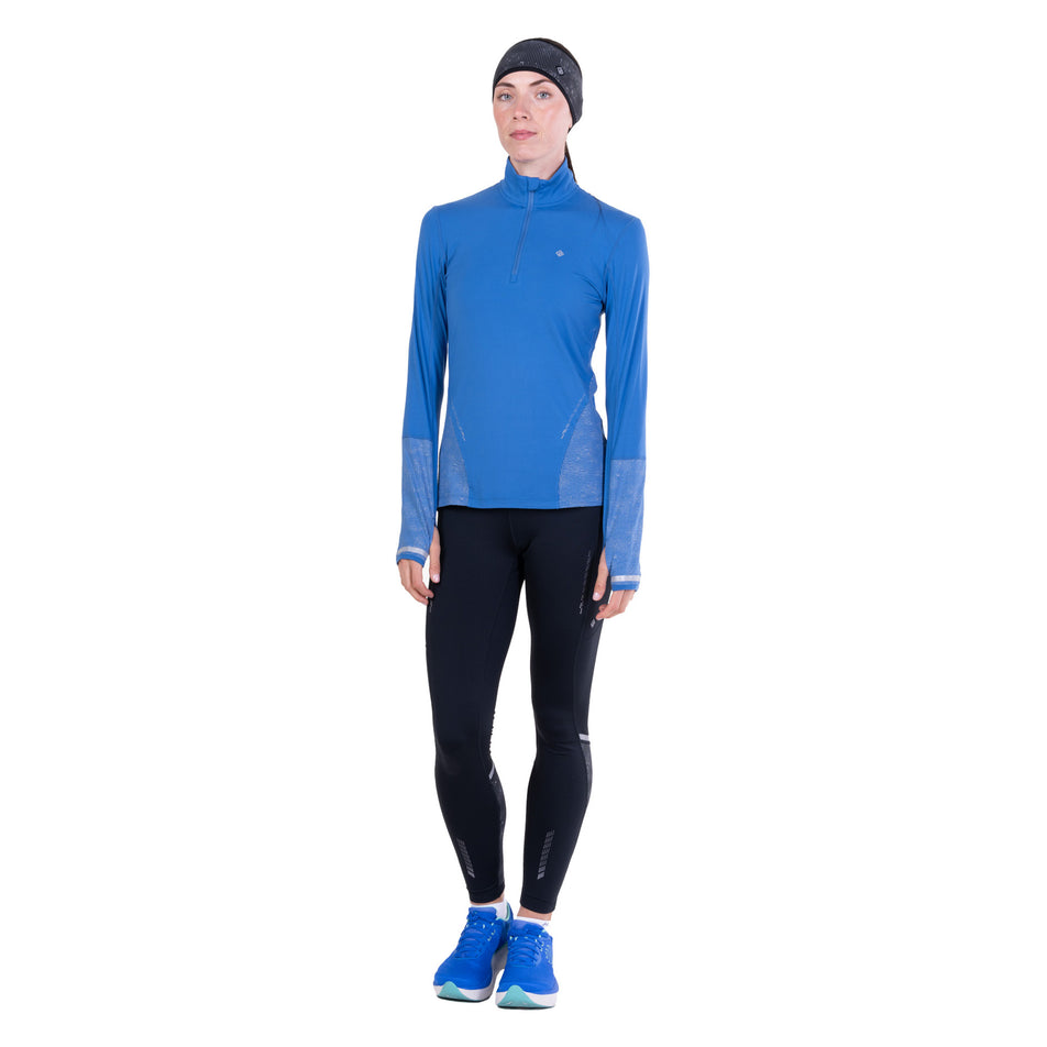 Front view of a model wearing the Ronhill Women's Tech Reflect 1/2 Zip in the Lumiere/Reflect colourway.