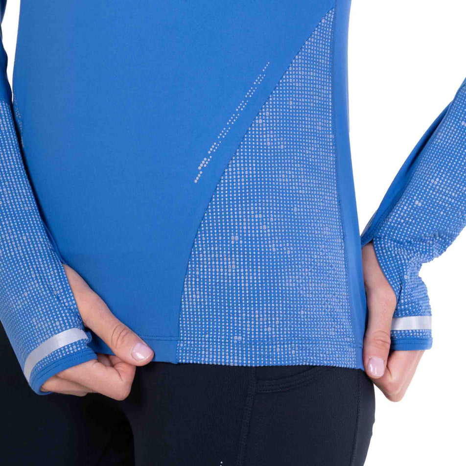 The reflective pattern on the Ronhill Women's Tech Reflect 1/2 Zip in the Lumiere/Reflect colourway.