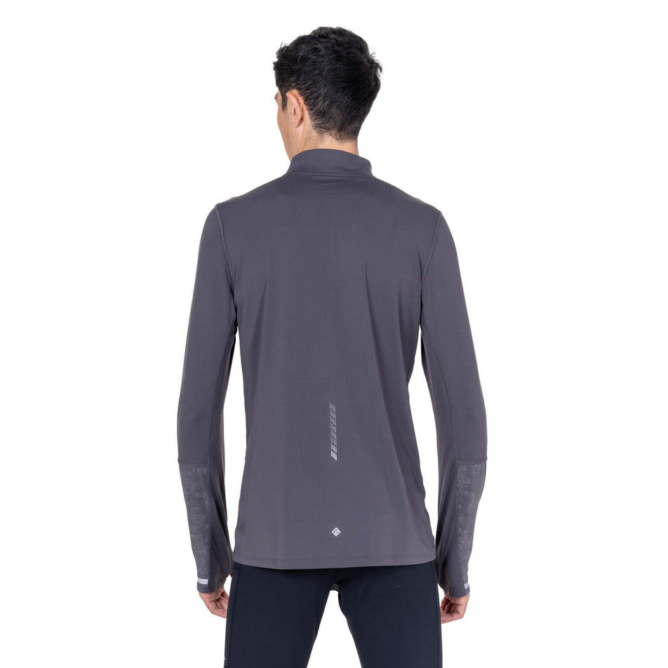 Back view of a model wearing the Ronhill Men's Tech Reflect 1/2 Zip in the Oxide/Reflect colourway.