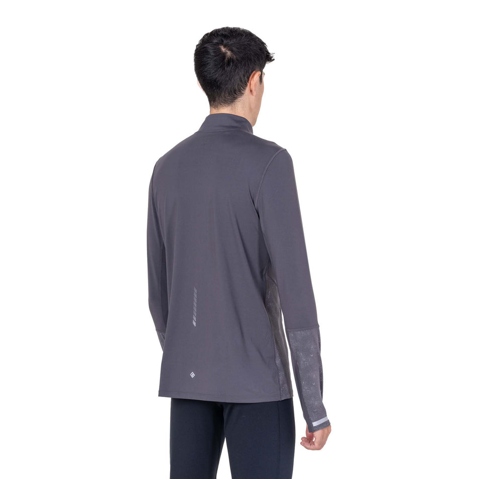 Back view of a model wearing the Ronhill Men's Tech Reflect 1/2 Zip in the Oxide/Reflect colourway.