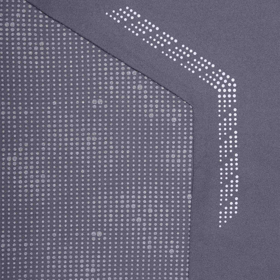 Close-up view of the reflective detail on the Ronhill Men's Tech Reflect 1/2 Zip in the Oxide/Reflect colourway.