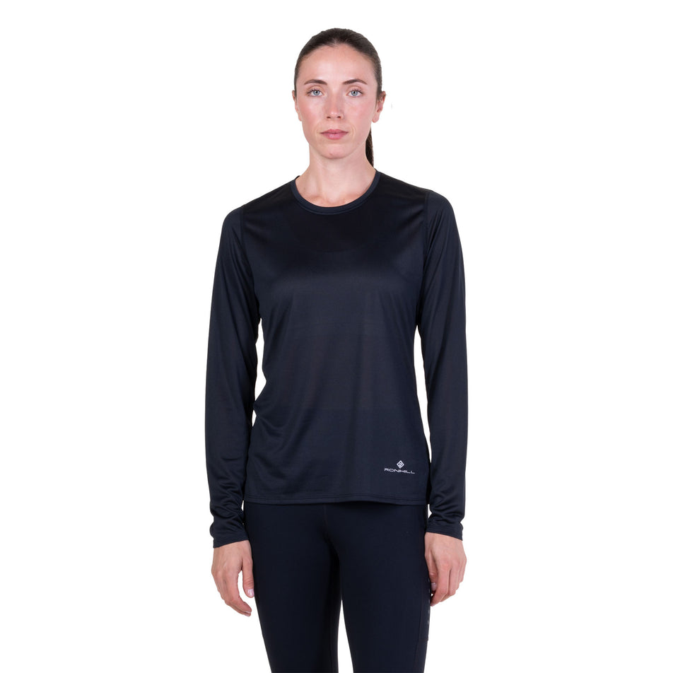 Front view of a model wearing the Ronhill Women's Core L/S Tee in the Black colourway.