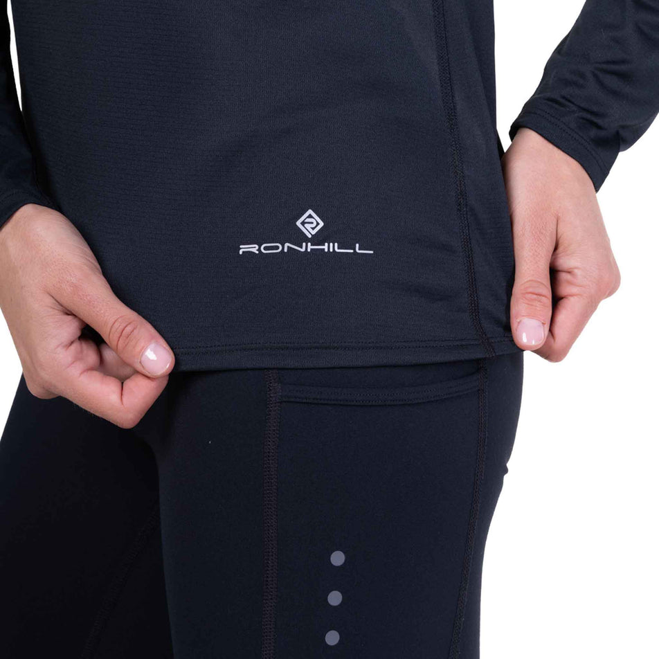 The Ronhill logo on the Ronhill Women's Core L/S Tee in the Black colourway.