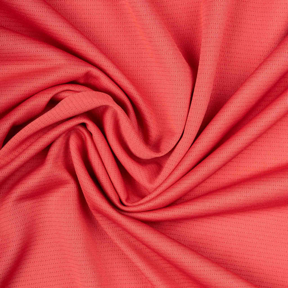 Close-up view of the fabric of the Ronhill Women's Core L/S Tee - Sumac/Blue Violet in the colourway.