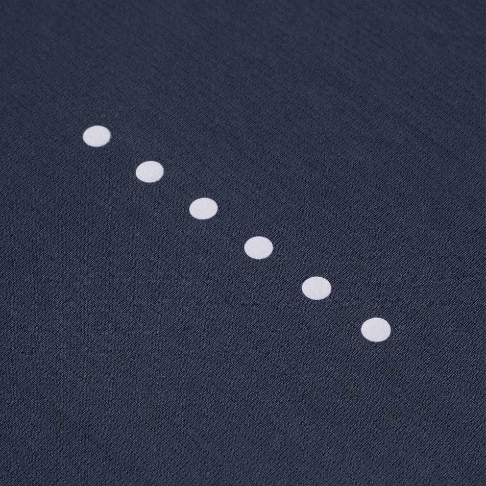 The reflective dots on the Ronhill Women's Core L/S Tee in the Black colourway.