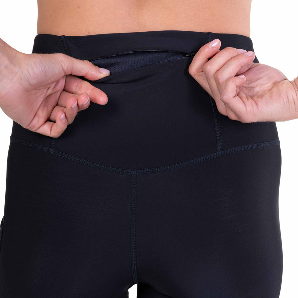 The back zip pocket on the Ronhill Women's Tech Wind-Block Tight in the All Black colourway.