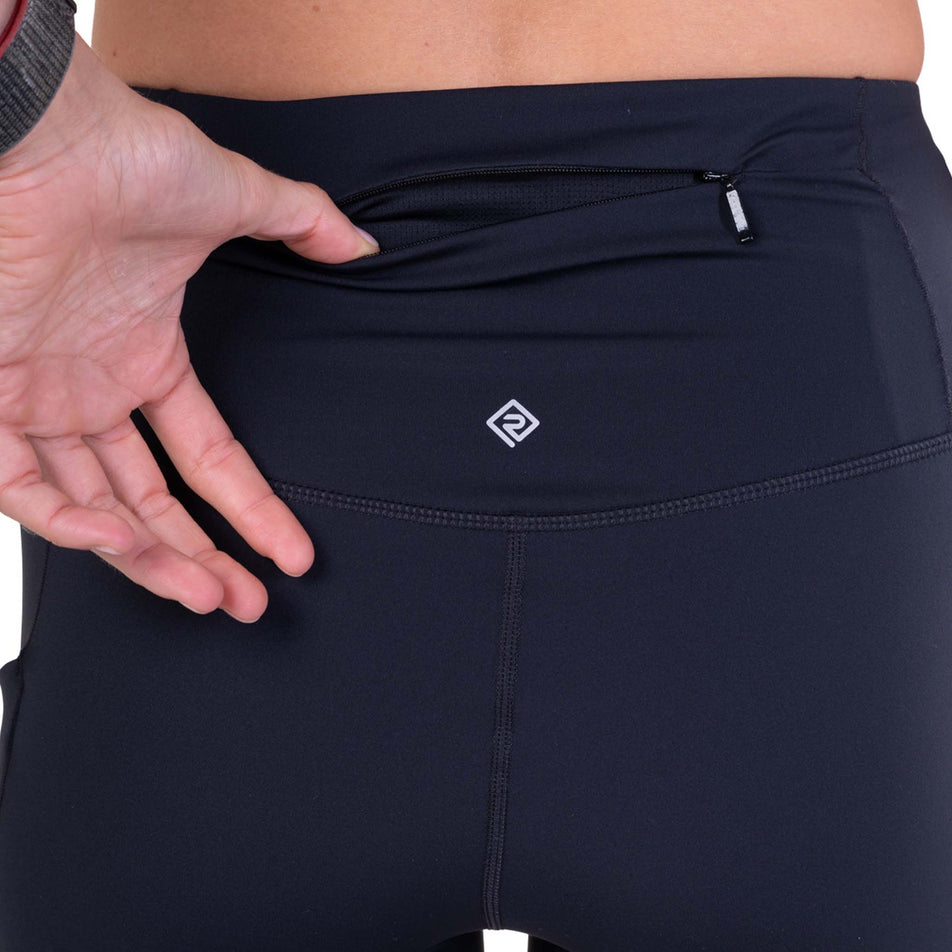 The zip back pocket on the Ronhill Women's Tech Contour Stretch Short in the All Black colourway.