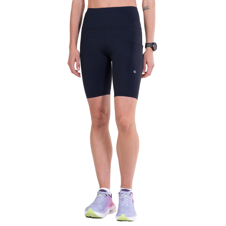 Front view of a model wearing the Ronhill Women's Tech Contour Stretch Short in the All Black colourway.