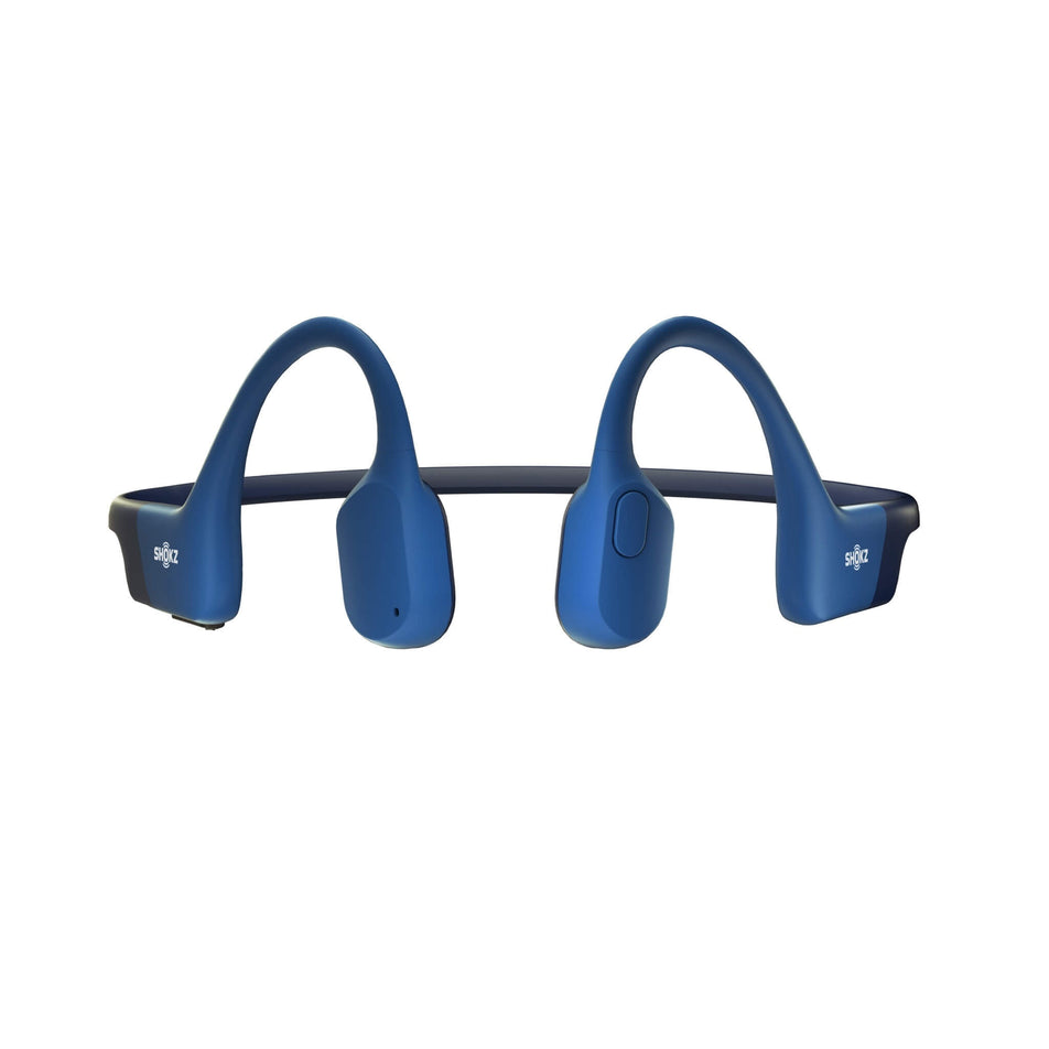 A pair of Shokz Unisex OpenRun Wireless Bone Conduction Headphones in the Blue clourway.  (8541454467234)