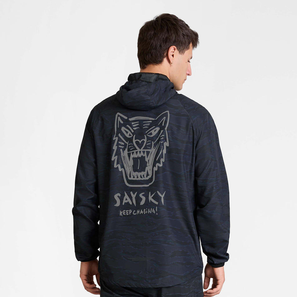 Back view of a model wearing the SAYSKY Men's Tiger Pace Jacket in the Black Camo colourway.