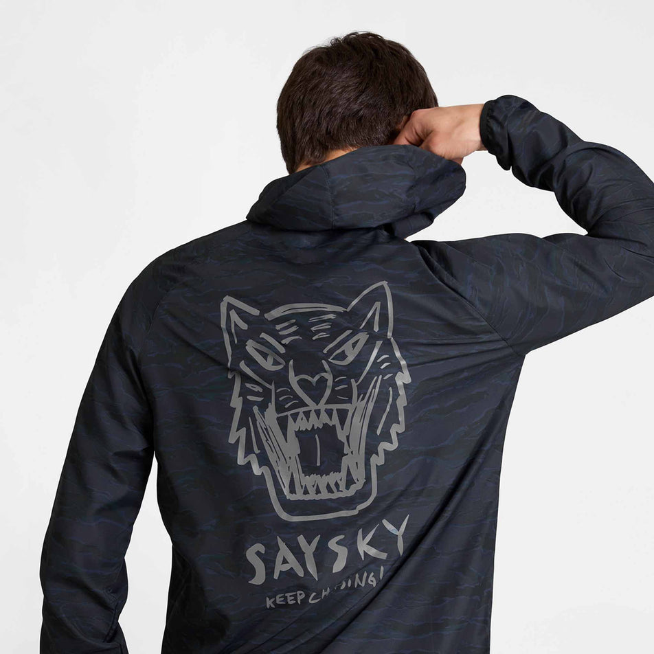 Back view of a model wearing the SAYSKY Men's Tiger Pace Jacket in the Black Camo colourway.