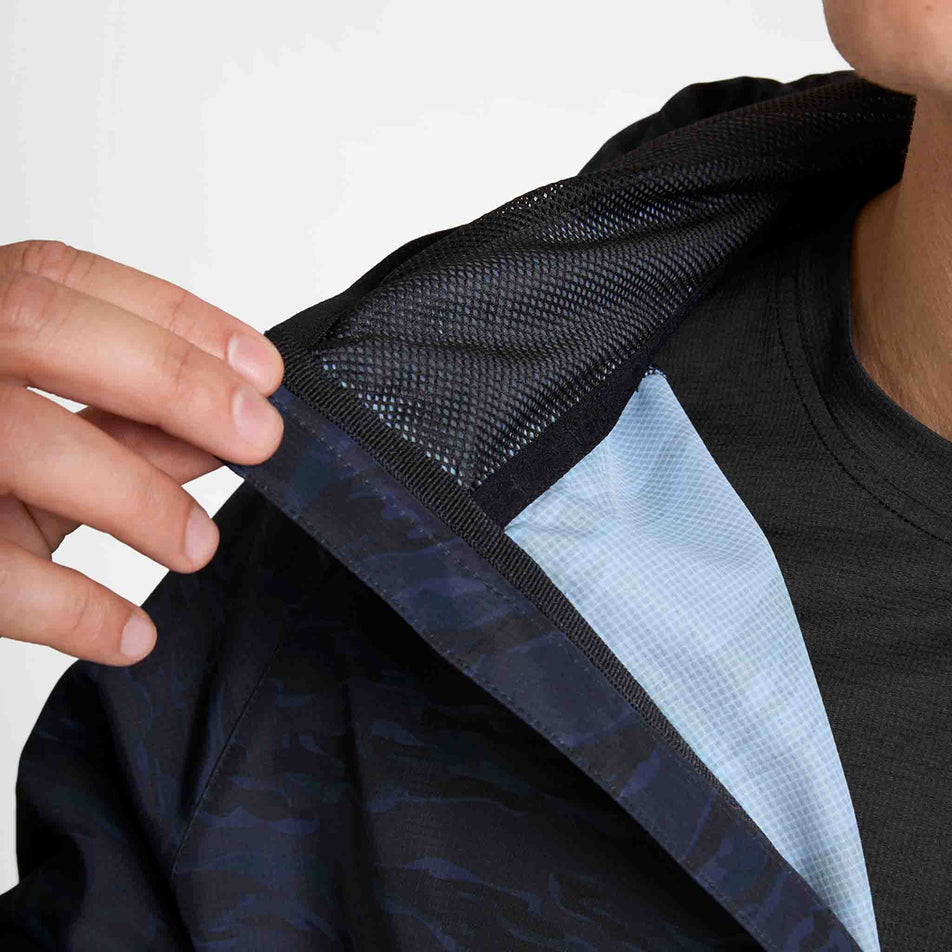 The inside of the neckline of the SAYSKY Men's Tiger Pace Jacket in the Black Camo colourway.