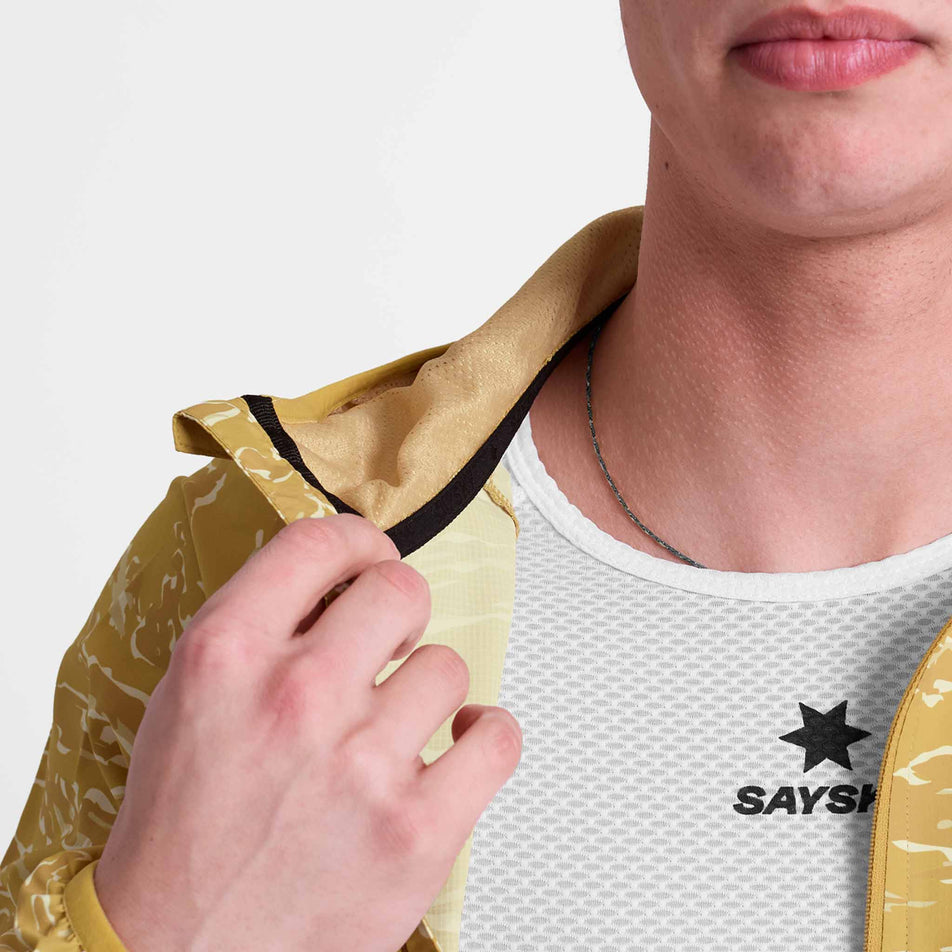 Front view of a model wearing the SAYSKY Men's Tiger Pace Jacket in the Yellow colourway.